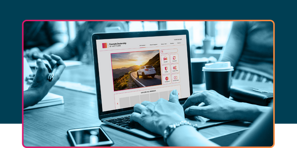 Hands using a laptop to browse a modern, responsive dealership website, showcasing vehicle inventory and conversion-focused design.